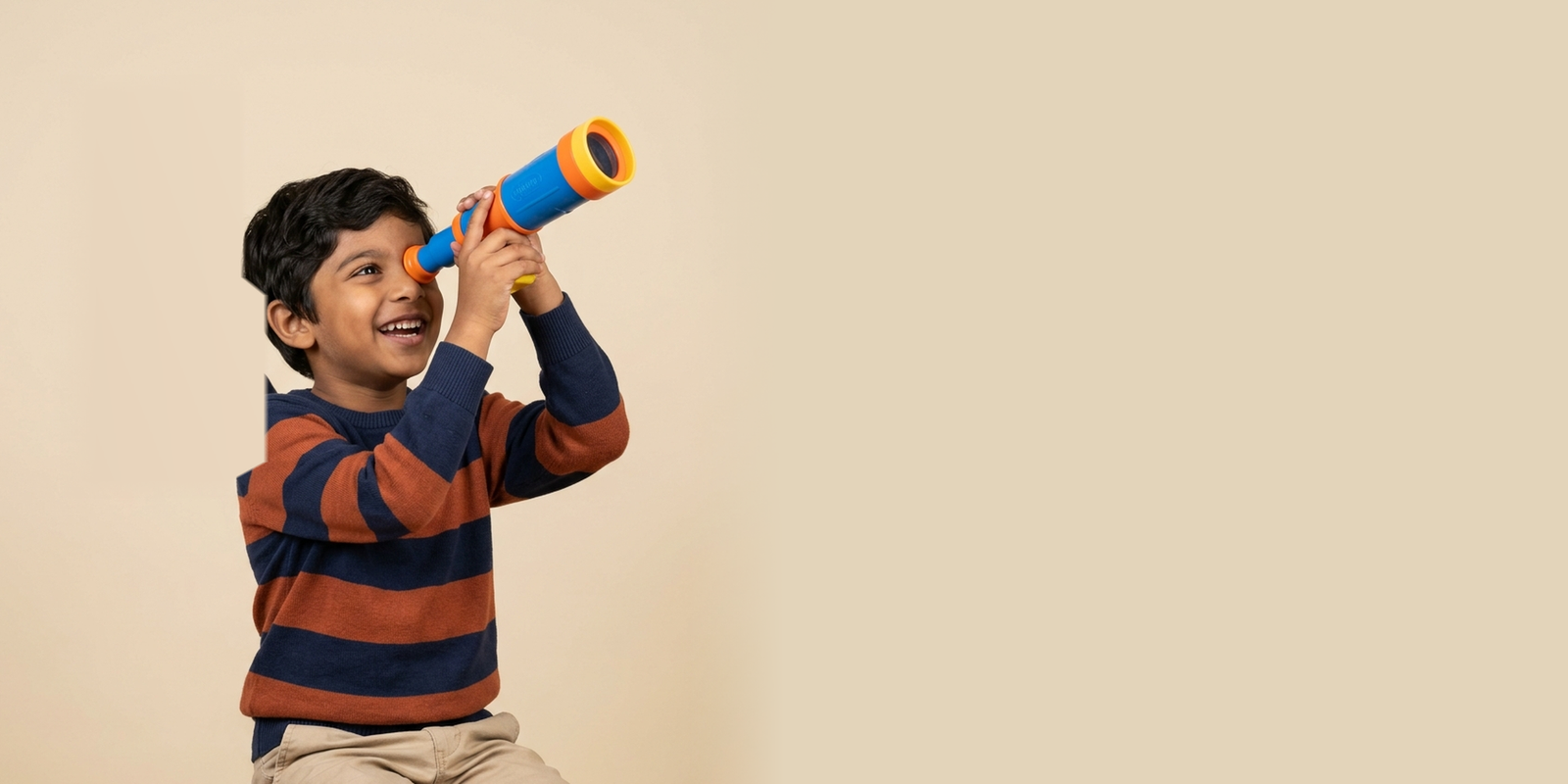A child looking at stars with telescope