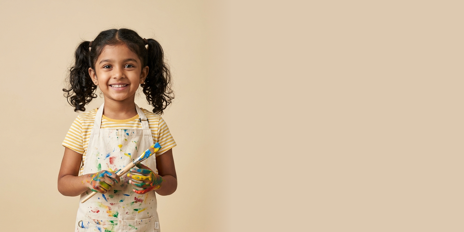 Children painting and expressing their creativity in nursery